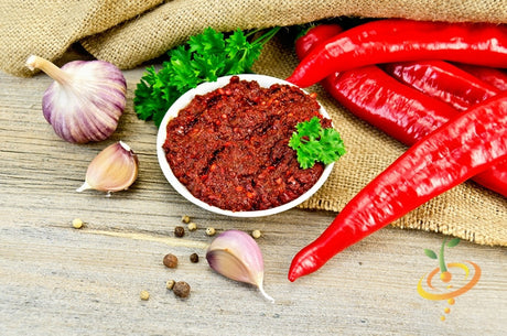 Hot Tabasco pepper seeds from SeedsNow, showing small, vibrant red pepper seeds for growing hot peppers.