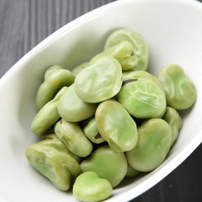 Lima bean plant from SeedsNow with green, pod-bearing stems and lush foliage, ready for garden planting.