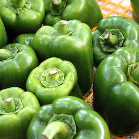 Sweet Emerald Giant pepper seeds from SeedsNow, showing vibrant green pepper fruit and seed packet on white background.